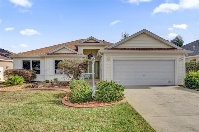 ranch-style home with a garage and a front yard