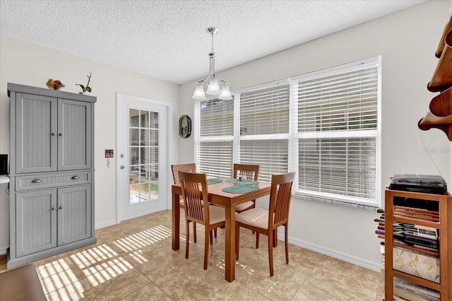 dining area with a textured ceiling