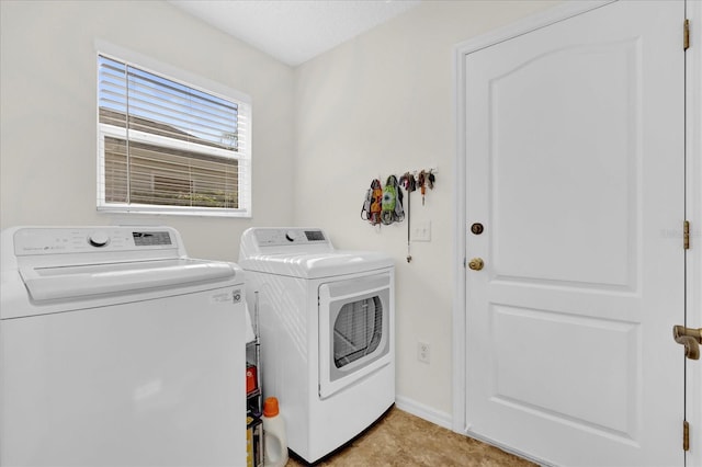 washroom with washing machine and dryer