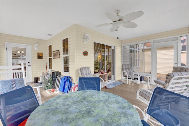 sunroom / solarium with ceiling fan