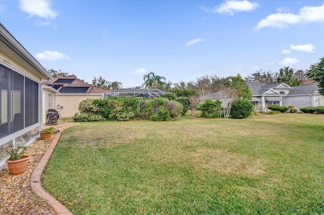 view of yard with a lanai