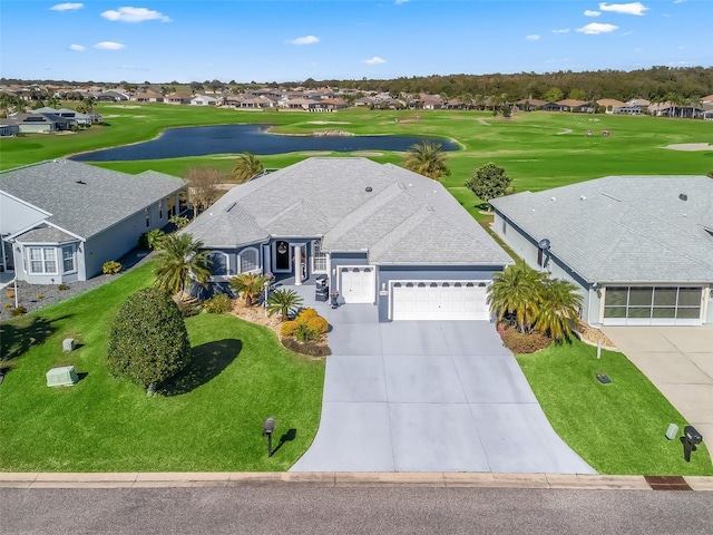 birds eye view of property with view of golf course and a residential view