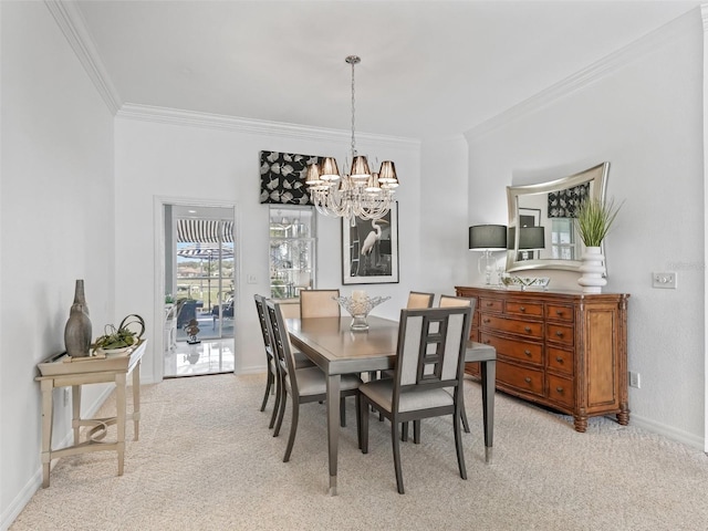 dining space with baseboards, ornamental molding, a chandelier, and light colored carpet