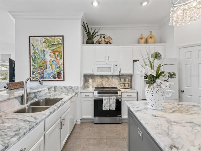 kitchen with white appliances, crown molding, white cabinetry, a sink, and light tile patterned flooring