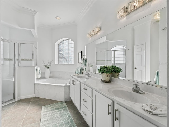 bathroom featuring a healthy amount of sunlight, a shower stall, ornamental molding, and a sink