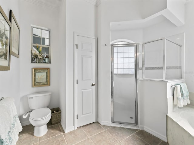 full bathroom with baseboards, toilet, tile patterned floors, a shower stall, and a bath