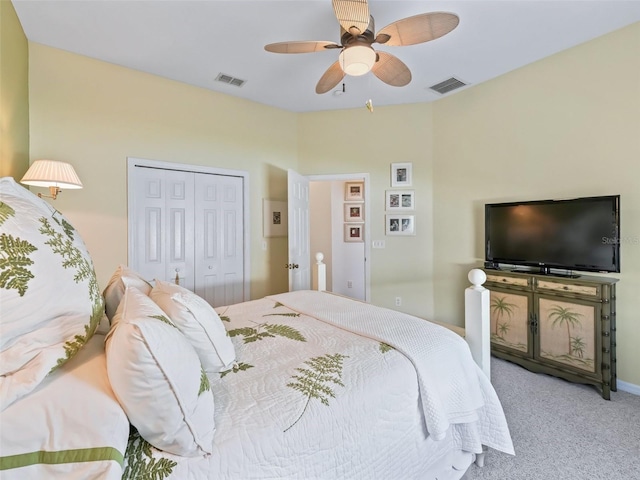 bedroom with a ceiling fan, a closet, visible vents, and light colored carpet