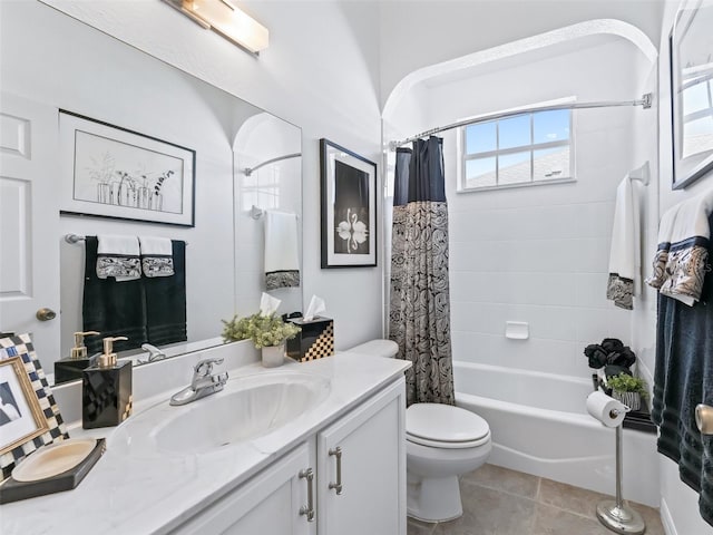 full bath featuring toilet, shower / bath combo, vanity, and tile patterned floors