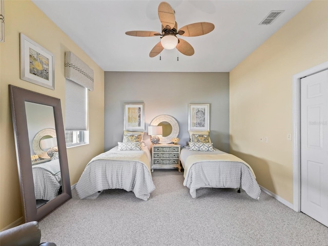 bedroom with a ceiling fan, carpet, visible vents, and baseboards