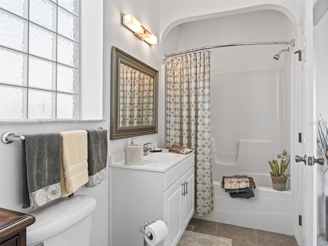 bathroom featuring shower / tub combo, vanity, toilet, and tile patterned floors