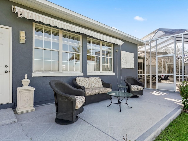 view of patio / terrace with glass enclosure