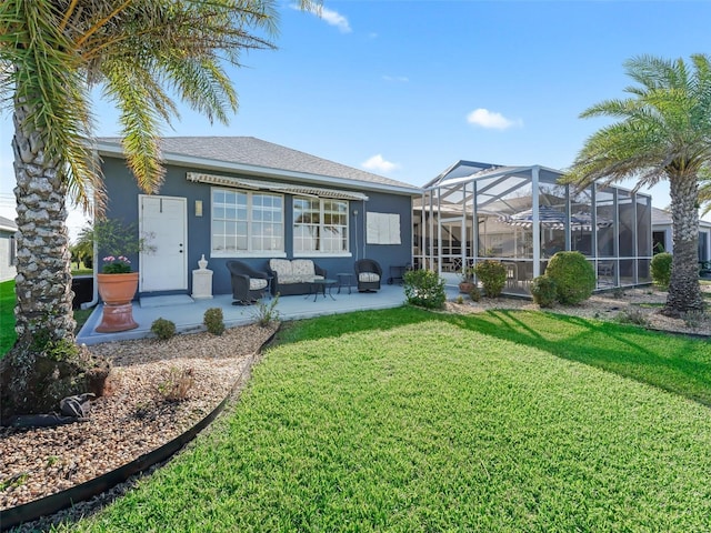 rear view of property with a lawn, a patio, a lanai, outdoor lounge area, and stucco siding