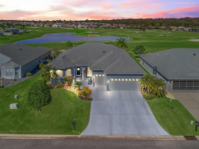 bird's eye view with golf course view, a water view, and a residential view