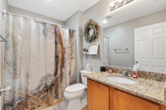 bathroom with vanity, toilet, tile patterned floors, a textured ceiling, and a shower with shower curtain