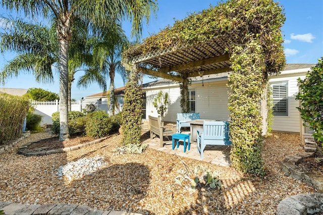 view of patio with fence and a pergola