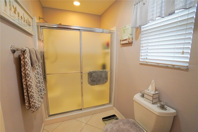 bathroom with tile patterned flooring and a shower with shower door