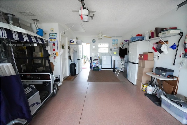 garage featuring ceiling fan and washer / clothes dryer