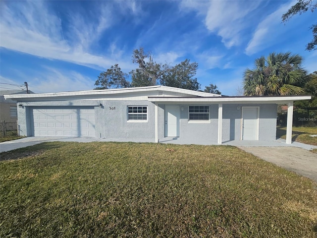 ranch-style home featuring a garage and a front yard