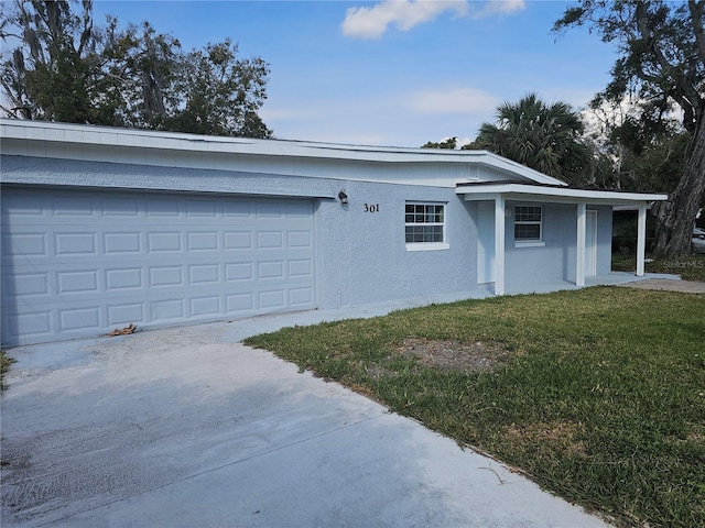 view of front of house with a garage and a front yard