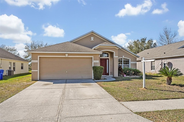 view of front facade with a garage, a front lawn, and central air condition unit