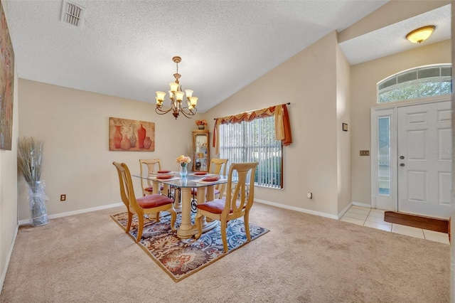 4078 Waltham Forest Dr, Tavares, FL 32778 - dining space featuring high vaulted ceiling, a textured ceiling, light colored carpet, and a chandelier