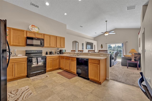 4078 Waltham Forest Dr, Tavares, FL 32778 - kitchen featuring sink, a textured ceiling, kitchen peninsula, ceiling fan, and black appliances