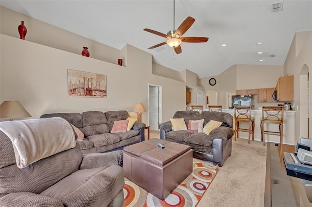4078 Waltham Forest Dr, Tavares, FL 32778 - carpeted living room featuring vaulted ceiling and ceiling fan