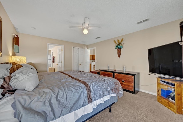 4078 Waltham Forest Dr, Tavares, FL 32778 - carpeted bedroom with ceiling fan, connected bathroom, and a textured ceiling