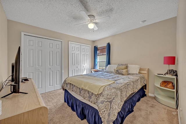 4078 Waltham Forest Dr, Tavares, FL 32778 - bedroom featuring light carpet, ceiling fan, a textured ceiling, and multiple closets
