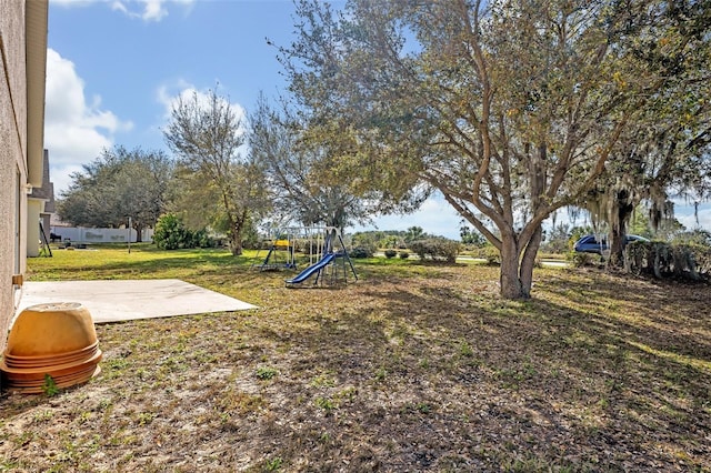4078 Waltham Forest Dr, Tavares, FL 32778 - view of yard with a playground and a patio area