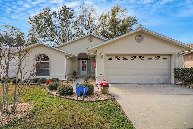 ranch-style house featuring a garage and a front lawn