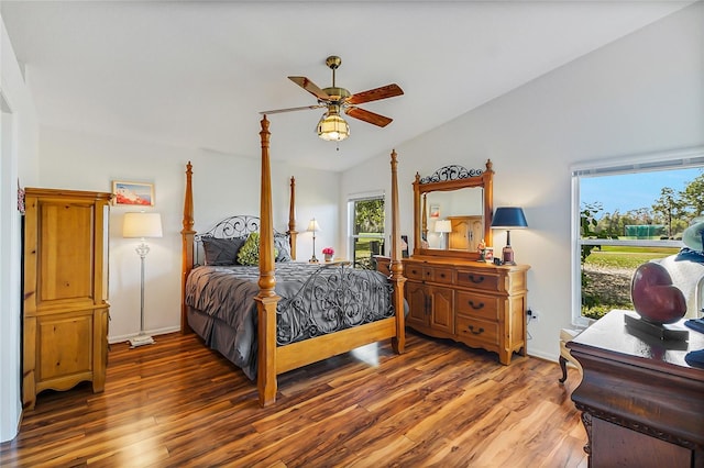 bedroom featuring vaulted ceiling, dark hardwood / wood-style floors, and ceiling fan