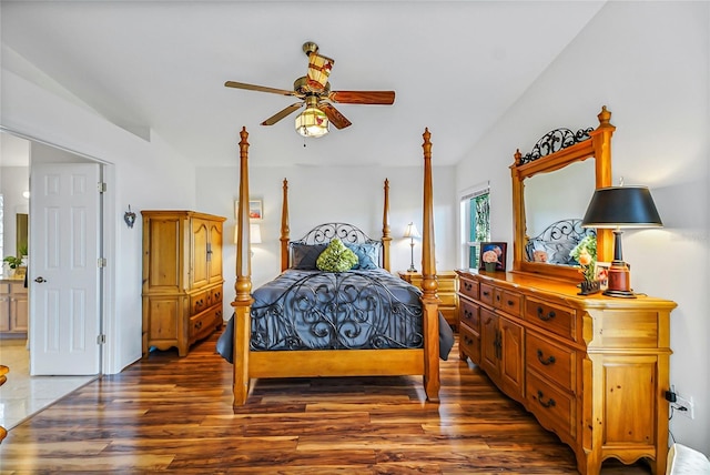 bedroom with ceiling fan and dark hardwood / wood-style flooring