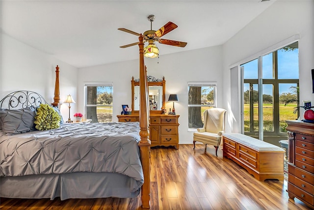 bedroom with light hardwood / wood-style flooring, ceiling fan, and vaulted ceiling