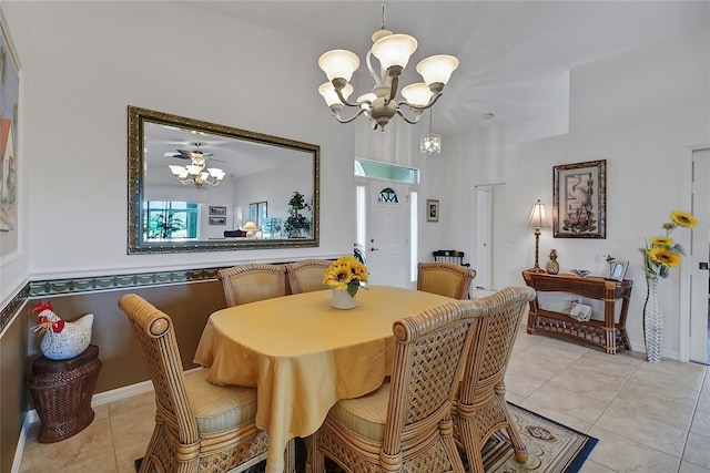 tiled dining area with a chandelier