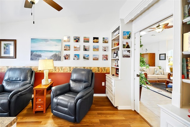 sitting room with hardwood / wood-style flooring and ceiling fan