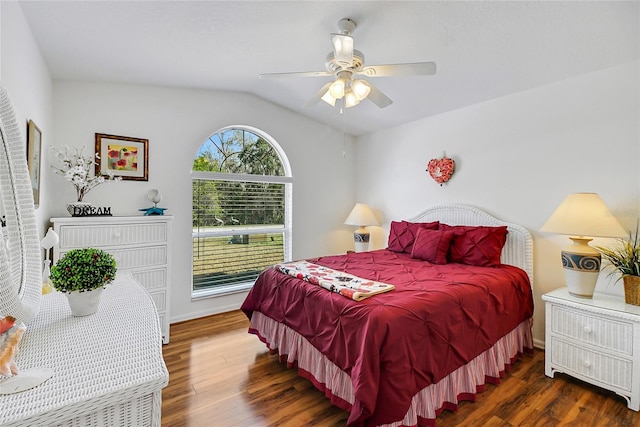 bedroom featuring ceiling fan, dark hardwood / wood-style floors, and vaulted ceiling