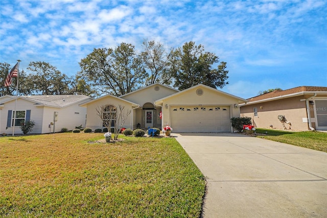 ranch-style home featuring a garage and a front lawn