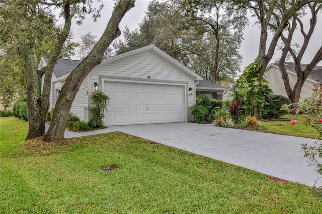 ranch-style home featuring driveway and a front lawn
