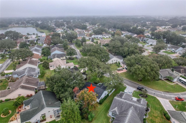 birds eye view of property featuring a residential view and a water view