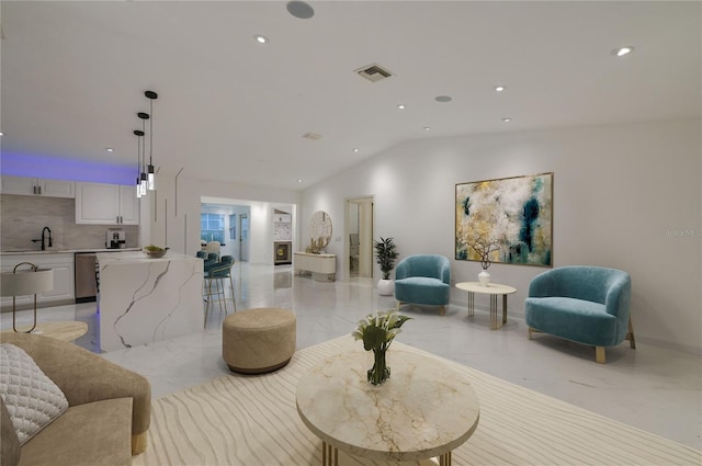 living area featuring visible vents, baseboards, lofted ceiling, recessed lighting, and marble finish floor
