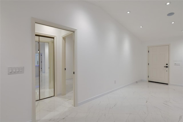 unfurnished room featuring recessed lighting, baseboards, and marble finish floor