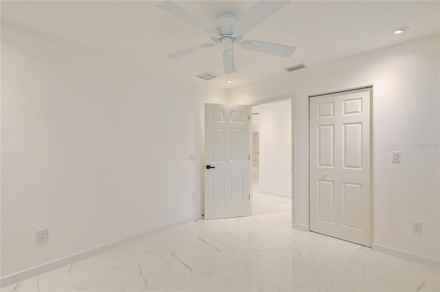 spare room featuring visible vents, marble finish floor, a ceiling fan, recessed lighting, and baseboards