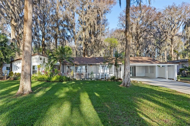 ranch-style house with concrete driveway and a front yard