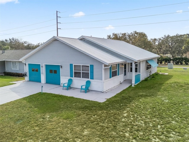 exterior space featuring a garage and a lawn