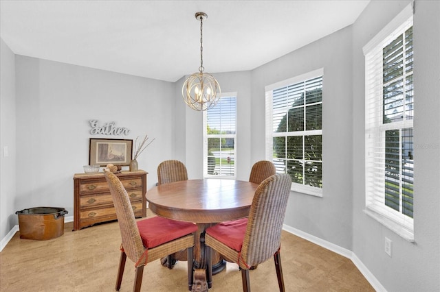 dining area featuring a notable chandelier