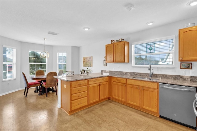 kitchen featuring pendant lighting, sink, stainless steel dishwasher, light stone counters, and kitchen peninsula