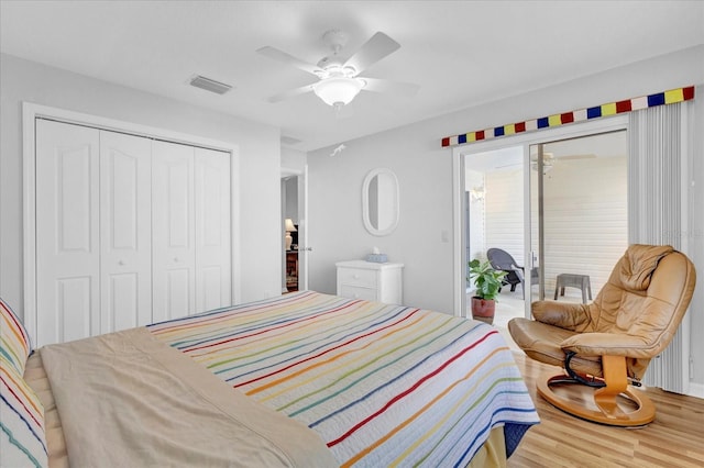 bedroom featuring access to exterior, wood-type flooring, a closet, and ceiling fan