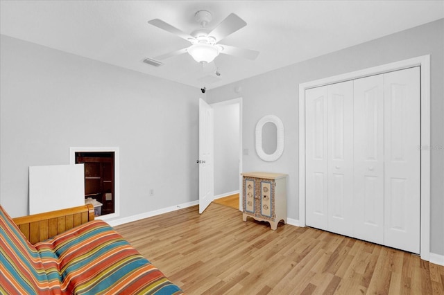 living area featuring ceiling fan and light wood-type flooring