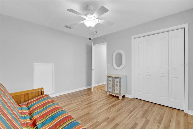 sitting room featuring ceiling fan and light hardwood / wood-style floors